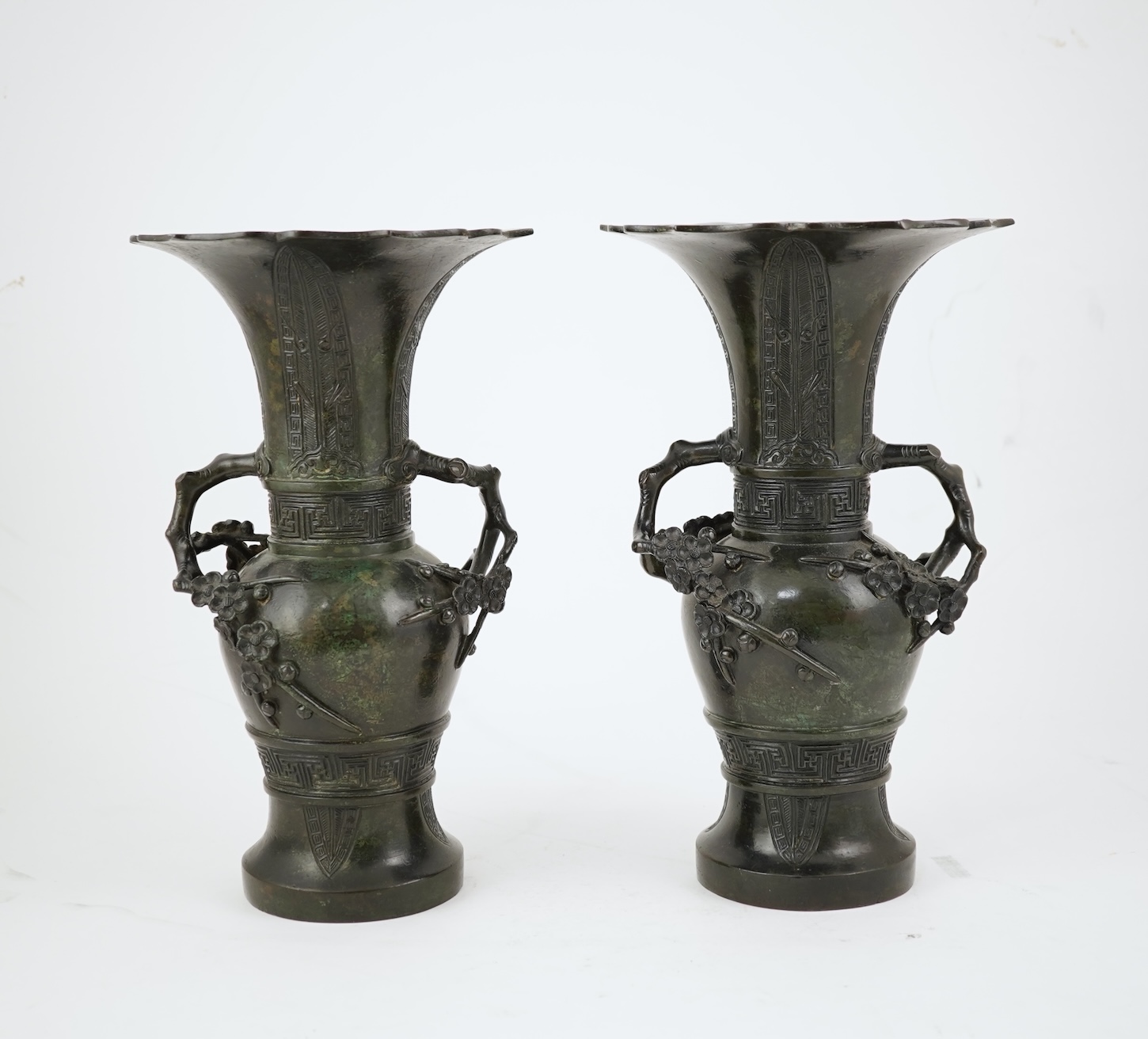A pair of Chinese bronze gu-shaped vases, Qing dynasty